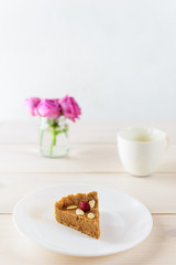 A slice of homemade apple tart on a plate. Sugar, lactose, gluten free. Vegan dessert, healthy food, without baking.
