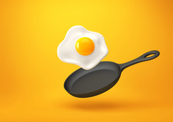 Fried egg and frying pan isolated on orange background. Clipping path included