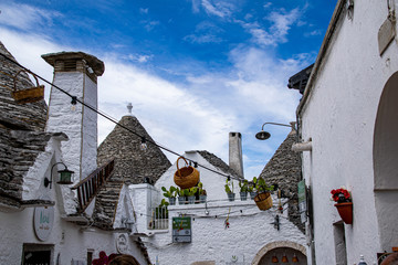 South of the Italy, alberobello with blue sky  in background and the trulli in foreground