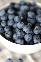 Selective focus. Macro. Blueberries in a bowl. Fresh blueberries with a bloom.