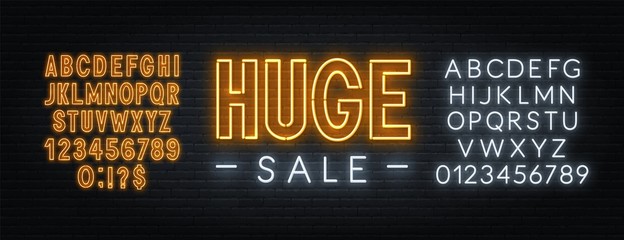 Huge Sale neon sign on brick wall background. Yellow and white neon alphabets.