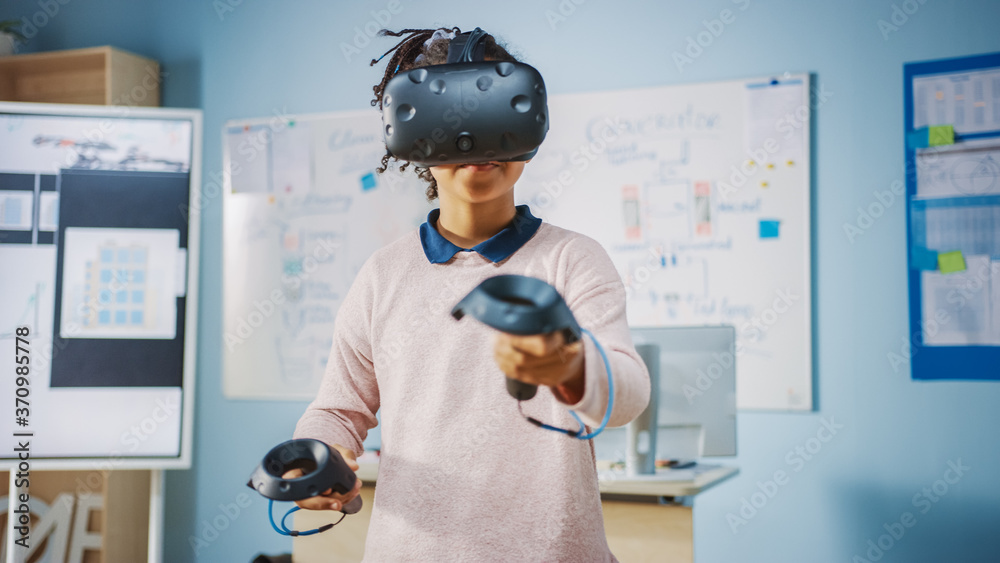 Poster elementary school computer science class: cute girl wearing augmented reality headset and using cont