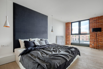 Bedroom with industrial style wall