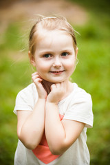 Portrait of a cheerful girl in the summer