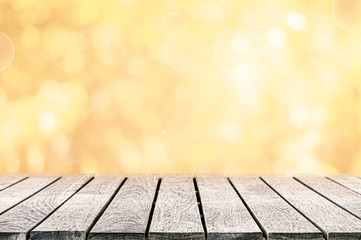 wood table top on the autumn background with bokeh lights