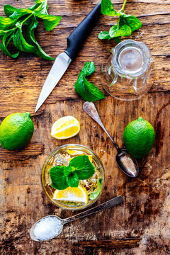 Top View Of Mojito Drink Ingredients On Vintage Wooden Table. Mint, Sugar And Lime Slices For Cuban Shoot Cocktail Making From Above.