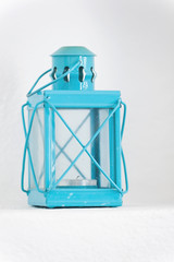 Vintage blue lantern closeup on white background