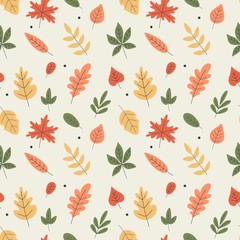 Autumn seamless pattern with colored leaves of oak, maple, linden, chestnut, poplar, aspen and dots. Vector illustration of cozy warm texture.