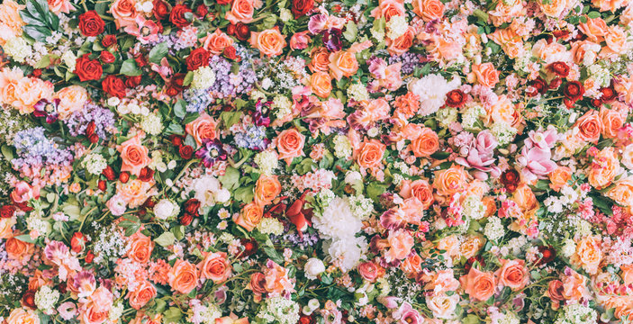 Beautiful floral wall background with fresh rose and flower bouquet pattern. Vintage wedding decoration banner.