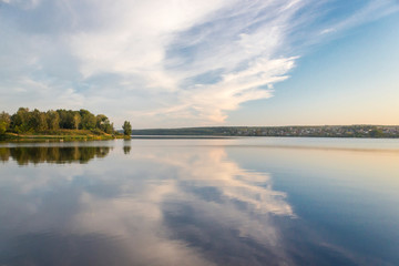 Reflection of clouds in the evening pond