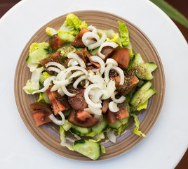 vegetarian healthy vegetable salad on brown plate