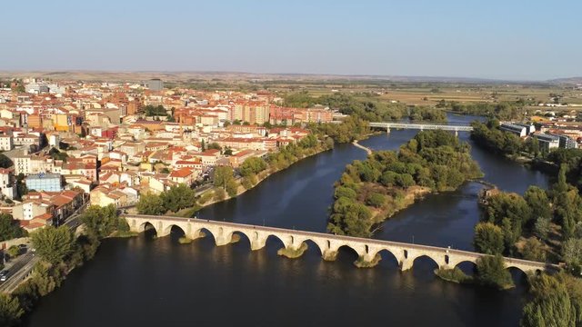 Zamora stone bridge over river. Zamora, historical city of Spain. Aerial Drone Footage 