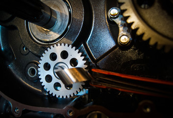 The inside of a motorcycle engine. Gear and parts clearance.