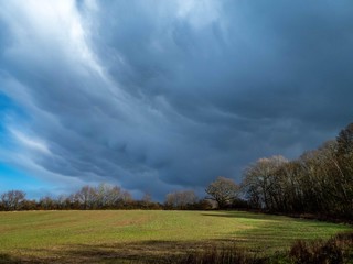 Fototapeta na wymiar storm clouds gathering over the farmland