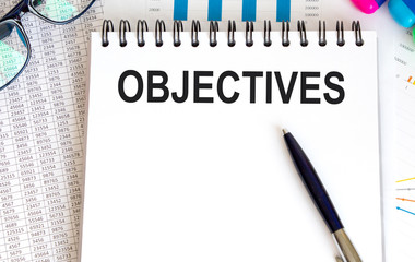 Paper with text objective on wood table