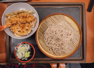 Japanese cold ramen noodles (Zaru ramen) with tempura set in Japanese style..Cold buckwheat soba noodles or zaru ramen with fried shrimps and vegetables tempura served on rice - Japanese food style