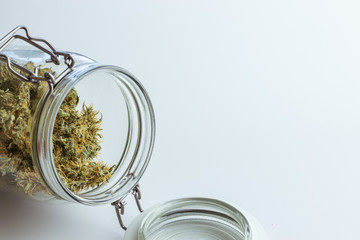 Open jar with cannabis buds. Dry marijuana for medical use. Weed concept design for web site...