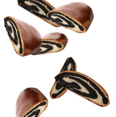 Buns with poppy seeds falling on white background