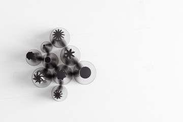 Cake decorating tip set on white background.