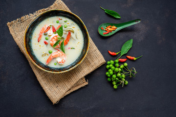 Thailand tradition Green curry with shrimp. Thai cuisine. (kang keaw wan). on old kitchen table with copy space.