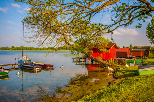 Boathouses at the shore of lake Schaal (Schaalsee) in Zarrentin, Mecklenburg-Western Pomerania, Germany