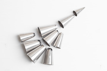 Cake decorating tip set on white background.