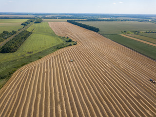 Fototapeta na wymiar Aerial drone view. Harvested Ukrainian wheat field.