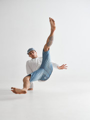 Cool guy breakdancer dancing lower break dance isolated on white background. Dance school poster....