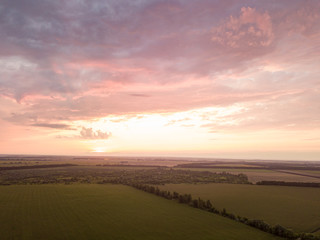 Obraz na płótnie Canvas Aerial view. Sunset over Ukrainian agricultural fields.