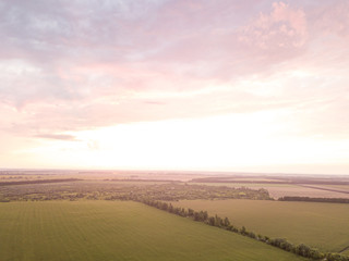 Obraz premium Aerial view. Sunset over Ukrainian agricultural fields.