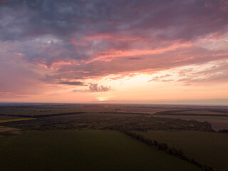 Aerial view. Sunset over Ukrainian agricultural fields.