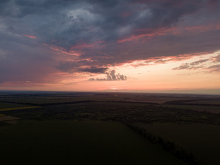 Aerial view. Sunset over Ukrainian agricultural fields.