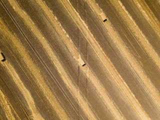 Aerial drone view. Harvested Ukrainian wheat field.