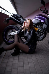 Fototapeta na wymiar Sport urban lifestyle. A motorbike with his female owner. Happy and beauty woman.