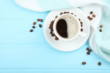 coffee beans and coffee cup on colored background with place for text

