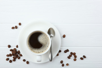 coffee beans and coffee cup on colored background with place for text
