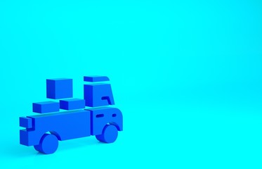 Fototapeta premium Blue Delivery truck with cardboard boxes behind icon isolated on blue background. Minimalism concept. 3d illustration 3D render.