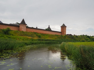 Naklejka na ściany i meble photo of the gates and towers of the Suzdal Kremlin in cloudy times