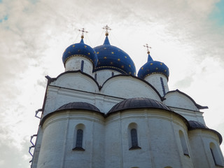 photos of old white stone Russian Orthodox churches in Suzdal