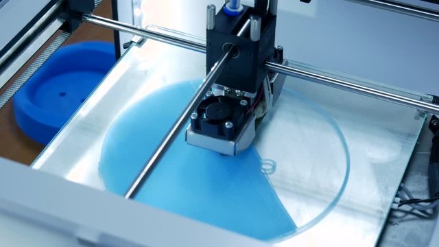 3D printer working. Fused deposition modeling, FDM. 3D printer printing an object from plastic. Automatic three dimensional 3d printer performs plastic. Progressive additive technology for 3d printing