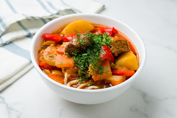 Lagman asian soup with beef on marble table