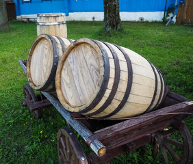 photo of two wooden barrels on a cart