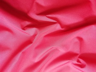 Abstract drapery of bright red fabric.