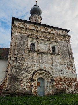 photo of an old dilapidated white stone Russian Orthodox Church