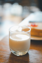 Fresh milk glass on the wood table