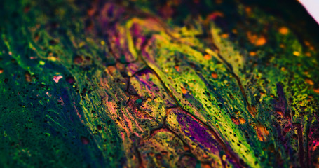 Macro Paint with Vibrant Color Palette. Oil Mixed with Rainbow Dye and Paint. Yellow Highlights.