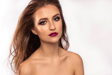 Amazing young woman with wavy hair, bright eyes and red lips. Perfect skin and beautyful hair