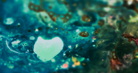 Macro Paint with Neon Color Palette. Oil Mixed with Green and Blue Dye and Paint. Green Bubbles.