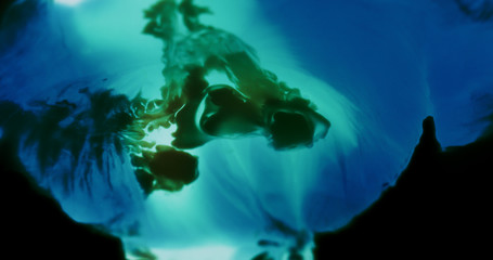 Macro Paint with Neon Color Palette. Oil Mixed with Blue and Teal Dye and Paint. Created Shadowy...