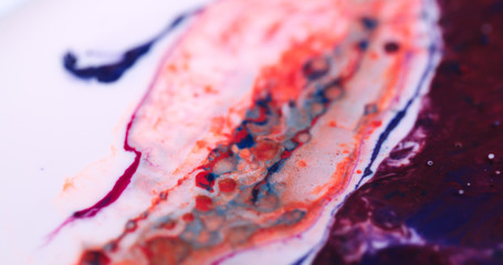Closeup Paint with Vibrant Color Palette. Oil Mixed with Bright Red and Blue Dye and Paint.